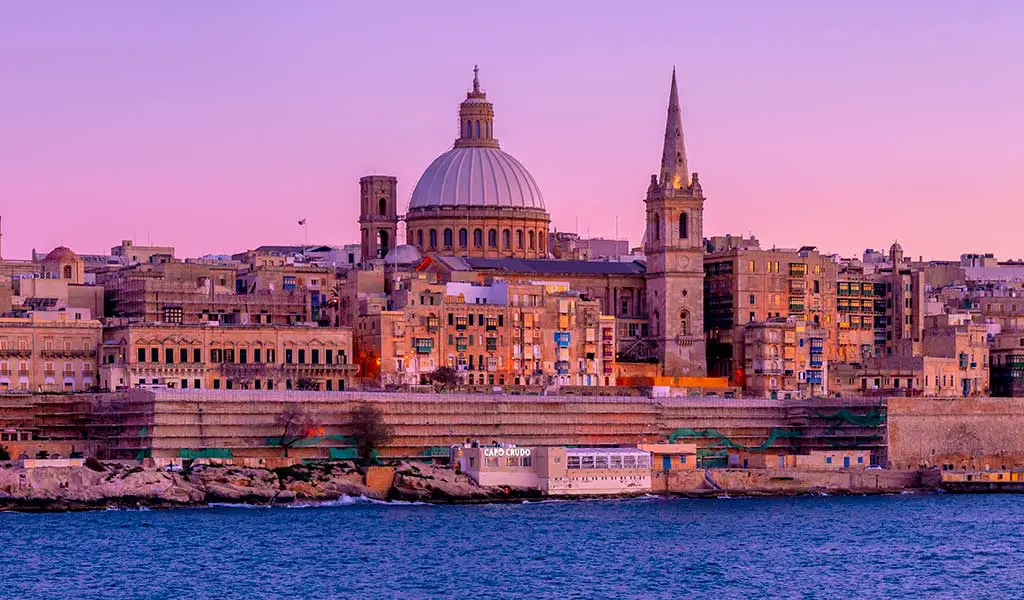 Valletta's magnificent skyline at sunset: A memorable view on popular Malta tours and excursions.
