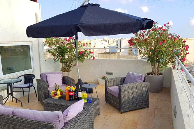 D TownHouse in Sliema (rooftop terrace pictured) provides holiday apartment lets with hotel service.