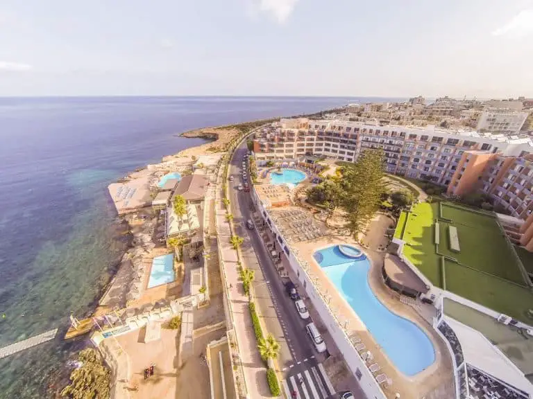 Aerial view of the Dolmen Hotel Malta and the seafront at Qawra.