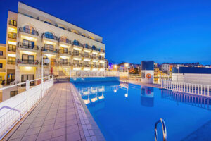 The Gillieru Harbour Hotel seen from its outdoor pool that overlooks the sea.