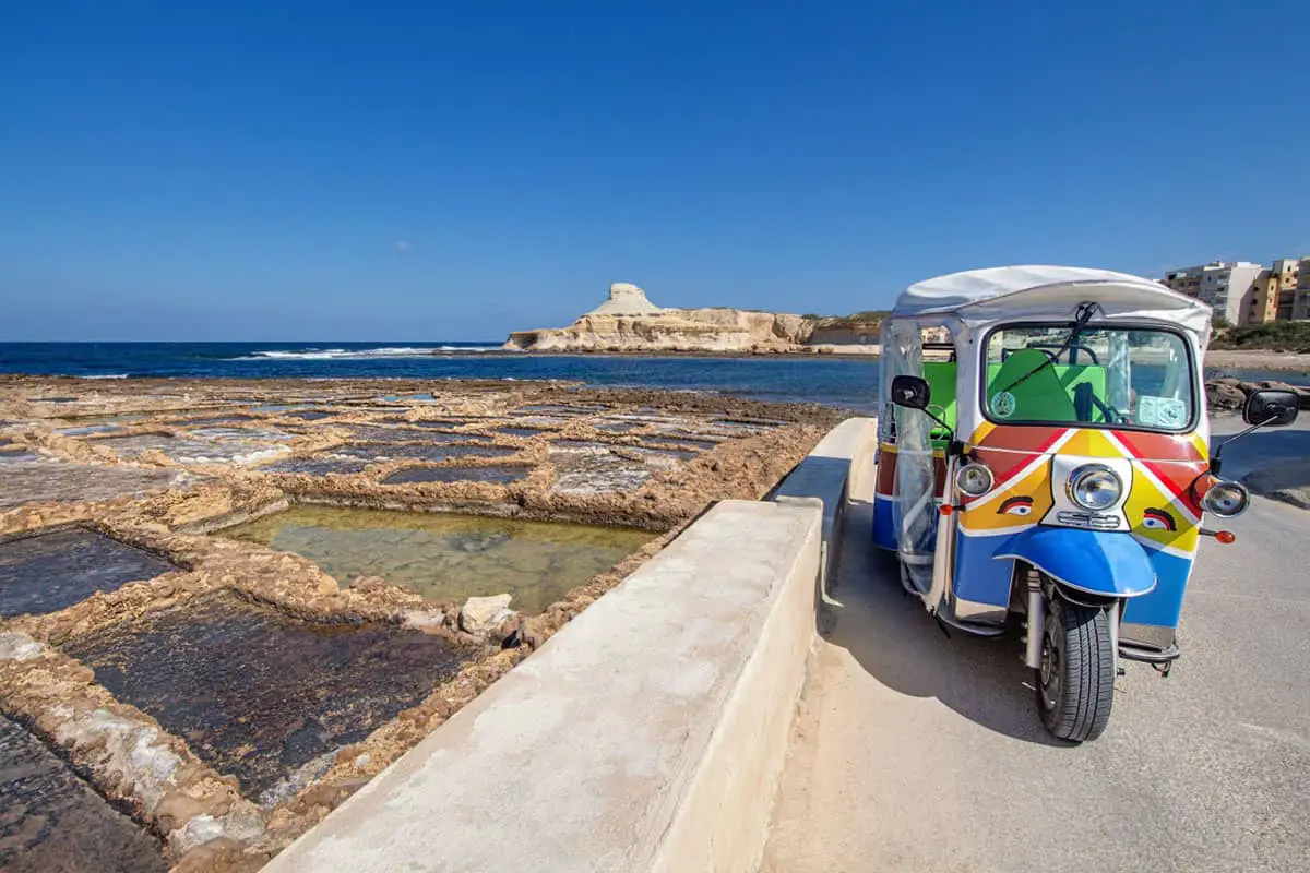 Tuk Tuk Gozo tour: A brightly coloured Tuk Tuk used on Malta day trips to Gozo.