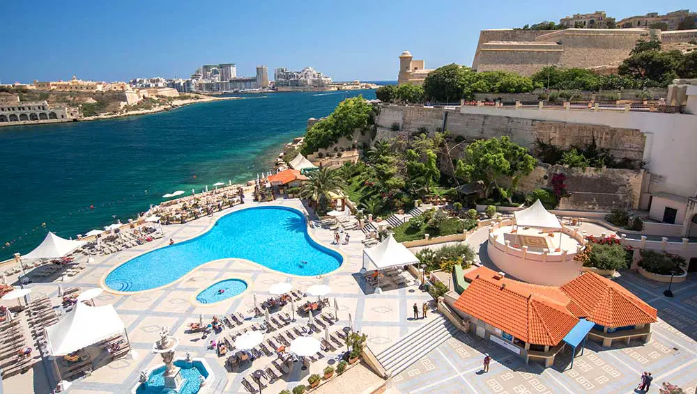 The outdoor pool and terrace with views over Grand Harbour.