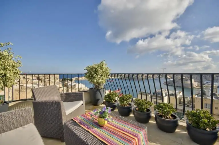 Outdoor terrace with harbour views at Palazzo Prince d'Orange.