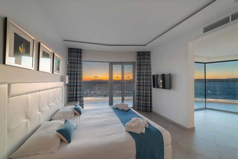 Panoramic suite with views of Gozo at Ramla Bay Resort.