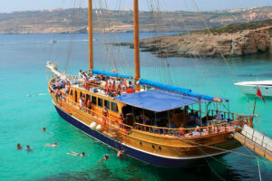Two-master boat trip from Sliema to the Blue Lagoon.